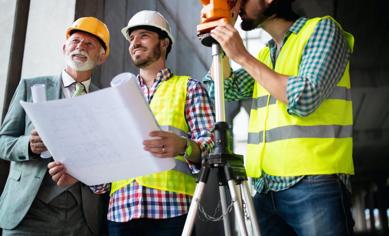Construction engineer with foreman worker checking construction site
